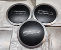 Coppetta coprimozzo copriruota nera con logo Fiat 500 - Debiautomotive